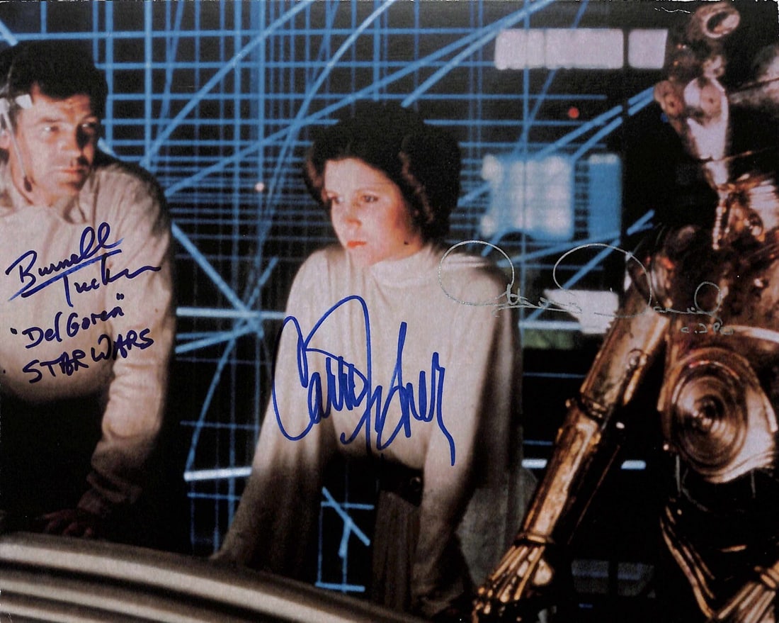 Beckett LOA Original 8x10 Star Wars Photo Signed by Fisher Tucker Daniels: Beckett LOA Original 8x10 Star Wars Photo Signed by Fisher Tucker Daniels Original 8x10 Star Wars photograph signed by Carrie Fisher, Burnell Tucker, and Anthony Daniels. The autographs are authentica