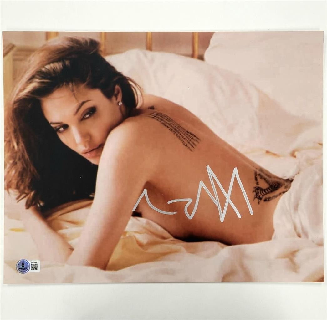 11x14 Photograph Signed by Angelina Jolie Beckett Authenticated Autograph: 11x14 Photograph Signed by Angelina Jolie Beckett Authenticated Autograph This is an original 11x14 photograph signed by actress Angelina Jolie. The autograph has been authenticated by Beckett and the