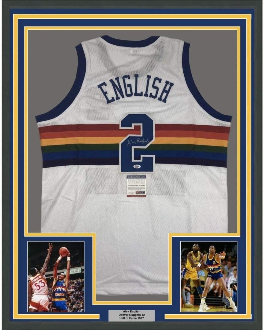 PSA Certified Alex English Signed Framed Denver Nuggets White Jersey 35x39: PSA Certified Alex English Signed Framed Denver Nuggets White Jersey 35x39 Professionally framed and matted autographed Alex English Denver white jersey display with two 5x7 photos. This original sign