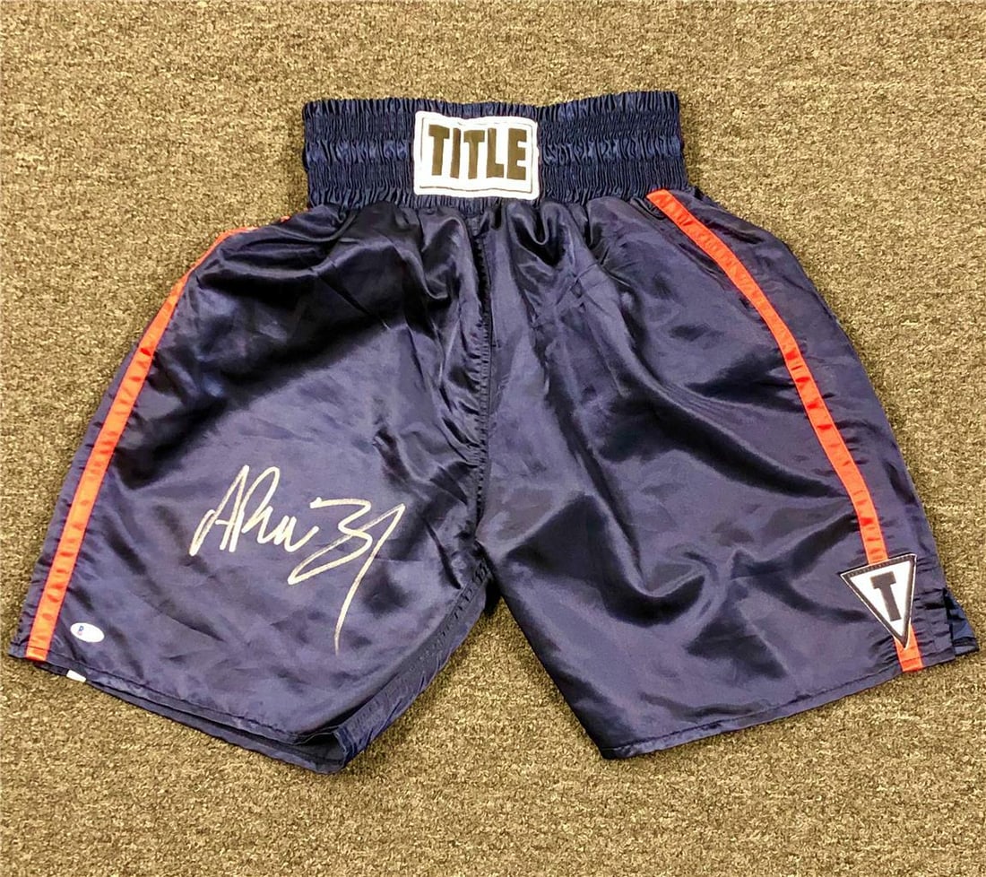 Andy Ruiz Jr autographed navy red boxing shorts with Beckett BAS authentication: Andy Ruiz Jr autographed navy red boxing shorts with Beckett BAS authentication These navy and red boxing trunks are personally signed by Mexican champion Andy Ruiz Jr. The autograph is authenticated 