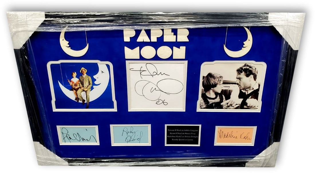Framed Paper Moon Cast Signed Collage Authenticated by JSA: Framed Paper Moon Cast Signed Collage Authenticated by JSA This is a framed collage featuring signed cuts from Tatum O'Neal, Ryan O'Neal, and Madeline Kahn, all stars of the film Paper Moon. The colla