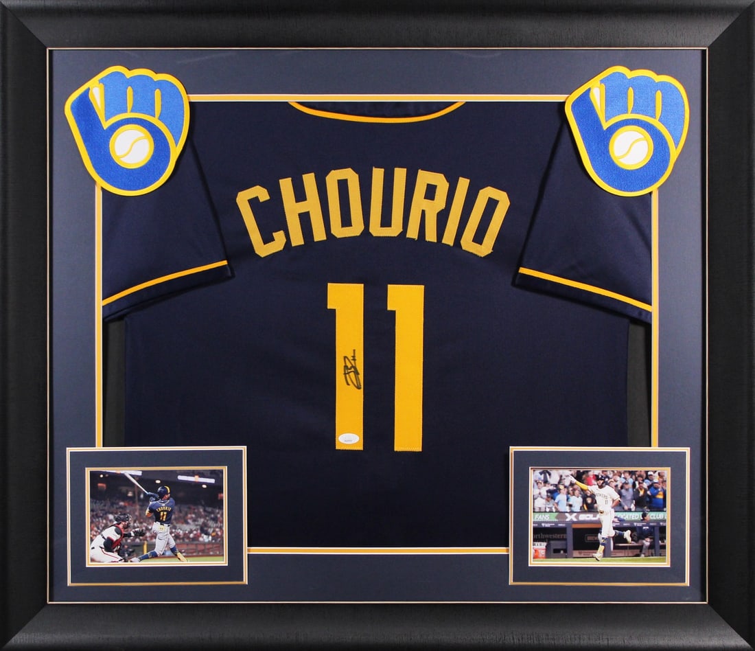 Framed Navy Jersey Signed by Jackson Chourio JSA Authentic: Framed Navy Jersey Signed by Jackson Chourio JSA Authentic Professionally framed autographed navy pro style jersey personally signed by Jackson Chourio of the Milwaukee Brewers. It is an original Sign