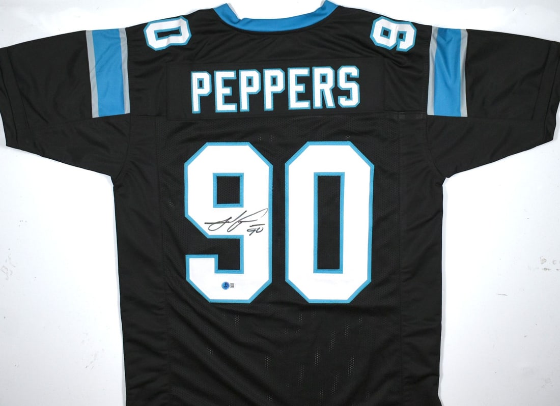 Black Football Jersey Signed by Julius Peppers Beckett BAS: Black Football Jersey Signed by Julius Peppers Beckett BAS Autographed black pro style football jersey associated with Julius Peppers. This pre-owned piece includes Beckett Authentication Services ver