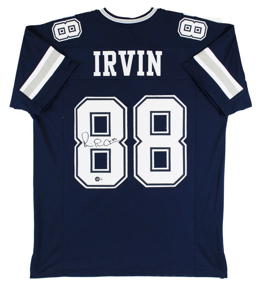 Navy Pro Style Jersey Signed by Michael Irvin Beckett Witnessed: Navy Pro Style Jersey Signed by Michael Irvin Beckett Witnessed This navy blue pro style jersey features a personal signature from Michael Irvin of the Dallas Cowboys. The autograph is authenticated b