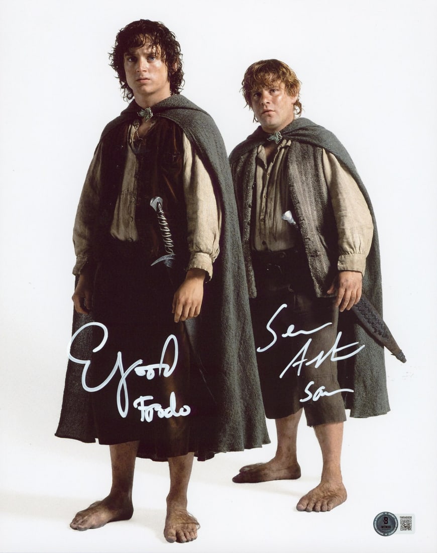 Elijah Wood and Sean Astin Signed 11x14 Photo BAS Witness Authenticated: Elijah Wood and Sean Astin Signed 11x14 Photo BAS Witness Authenticated This 11x14 vertical studio photograph from Lord of the Rings is personally signed by Elijah Wood and Sean Astin, with the inscri