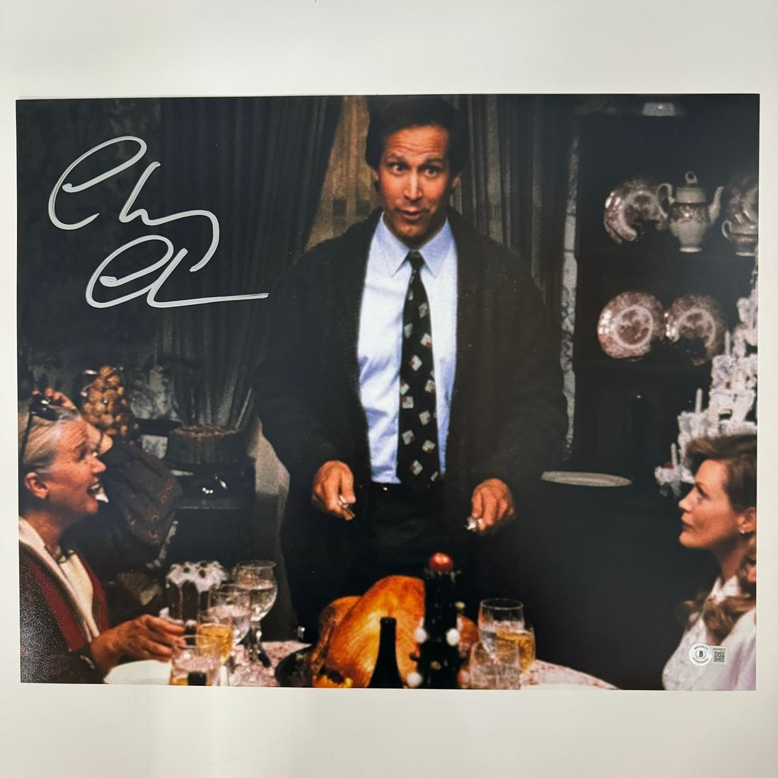 Chevy Chase signed 16x20 Christmas Vacation photograph Beckett COA: Chevy Chase signed 16x20 Christmas Vacation photograph Beckett COA Autographed 16x20 photograph signed by Chevy Chase from Christmas Vacation. This original photo is authenticated by Beckett Grading S