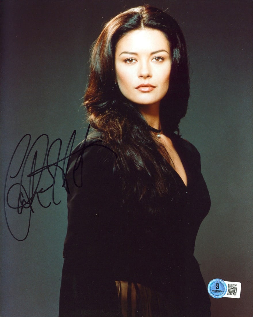 Catherine Zeta-Jones signed Entrapment 8x10 vertical photo Beckett BAS: Catherine Zeta-Jones signed Entrapment 8x10 vertical photo Beckett BAS Authentic signed vertical 8x10 photograph from Entrapment, personally autographed by Catherine Zeta-Jones. This original photo in