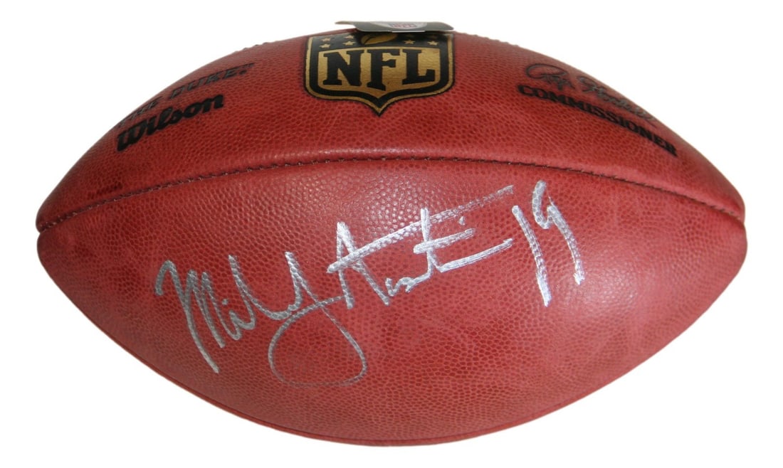 Dallas Cowboys football signed by Miles Austin Beckett authenticated leather ball: Dallas Cowboys football signed by Miles Austin Beckett authenticated leather ball This official NFL leather football is signed by Miles Austin of the Dallas Cowboys. The autograph has been authenticat