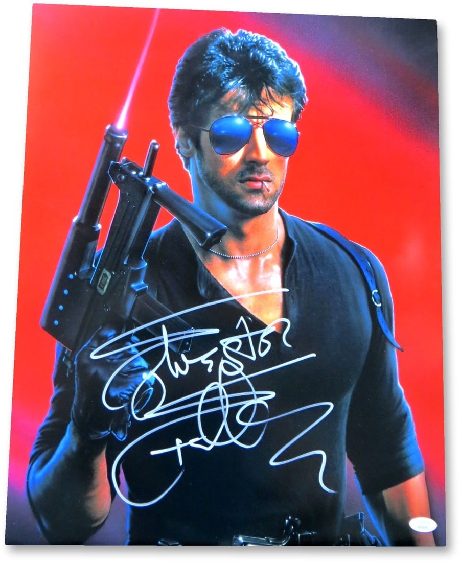 16X20 Cobra Photograph Signed by Sylvester Stallone JSA: 16X20 Cobra Photograph Signed by Sylvester Stallone JSA Original 16x20 photograph signed by Sylvester Stallone from Cobra. This autographed photo is authenticated by James Spence (JSA) and is offered