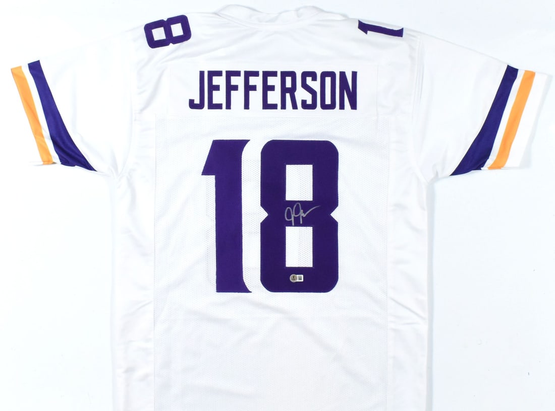 Justin Jefferson Signed Vikings White Football Jersey Beckett BAS Hologram: Justin Jefferson Signed Vikings White Football Jersey Beckett BAS Hologram Autographed white pro style football jersey featuring Justin Jefferson. This pre-owned piece includes Beckett Authentication 