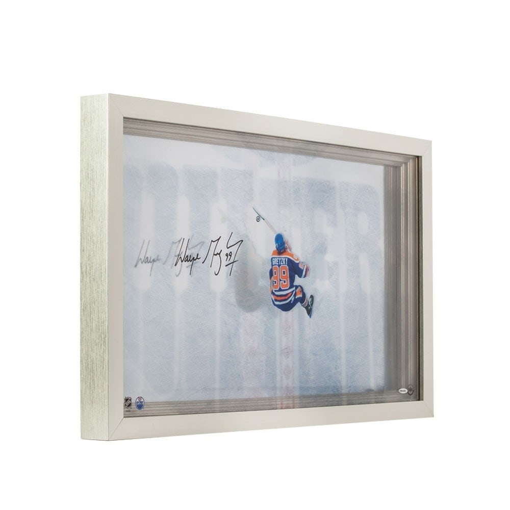 Framed 31X19 Wayne Gretzky Signed Acrylic Photo From Above UDA: Framed 31X19 Wayne Gretzky Signed Acrylic Photo From Above UDA Framed acrylic photo titled "From Above" signed by Wayne Gretzky. This original autographed piece is authenticated by Upper Deck and feat