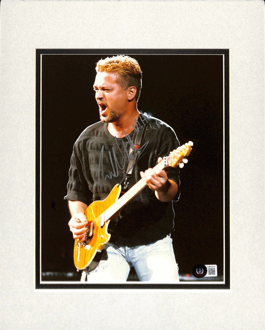 Beckett LOA Eddie Van Halen Autographed 8x10 Color Photo: Beckett LOA Eddie Van Halen Autographed 8x10 Color Photo Original autographed 8x10 color photograph signed by Eddie Van Halen in silver permanent marker. The piece is mounted, double matted, and ready