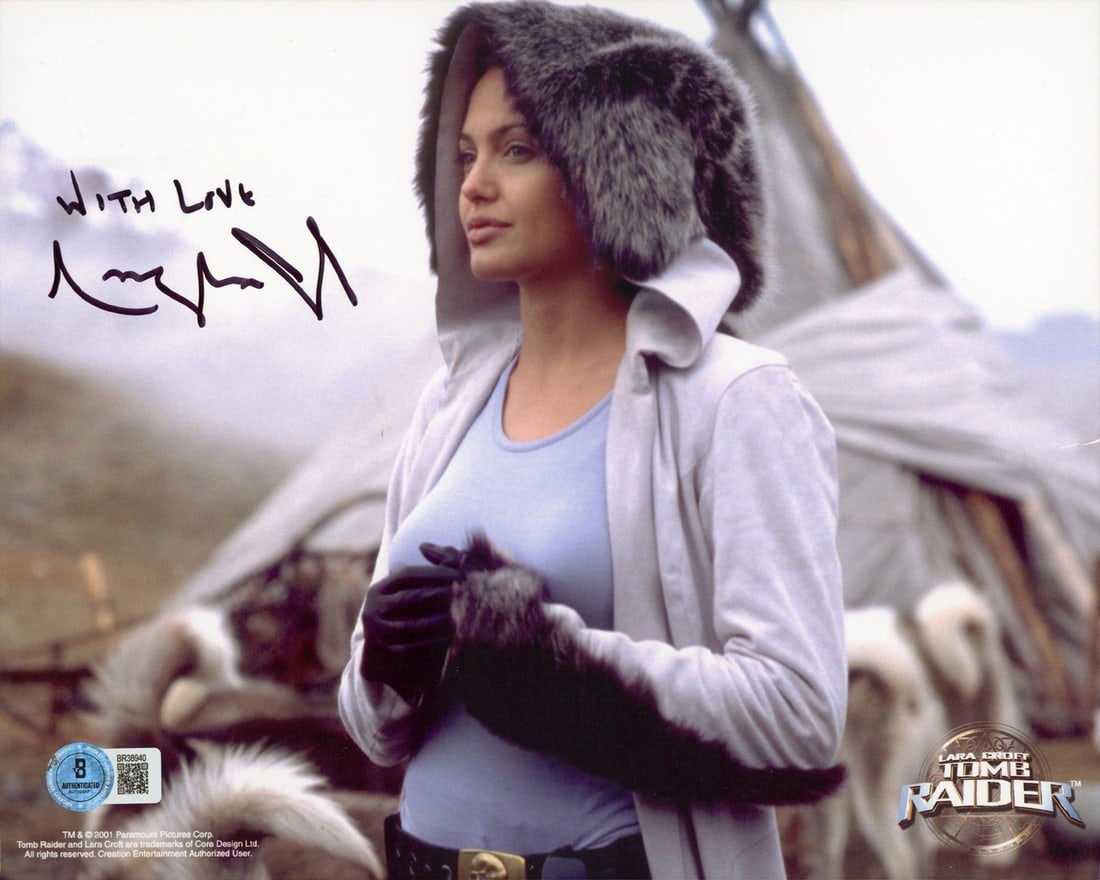 Beckett authenticated Angelina Jolie signed Tomb Raider 8x10 photo: Beckett authenticated Angelina Jolie signed Tomb Raider 8x10 photo This is an autographed 8x10 horizontal photograph from Tomb Raider, personally signed by Angelina Jolie with the inscription "With Lo
