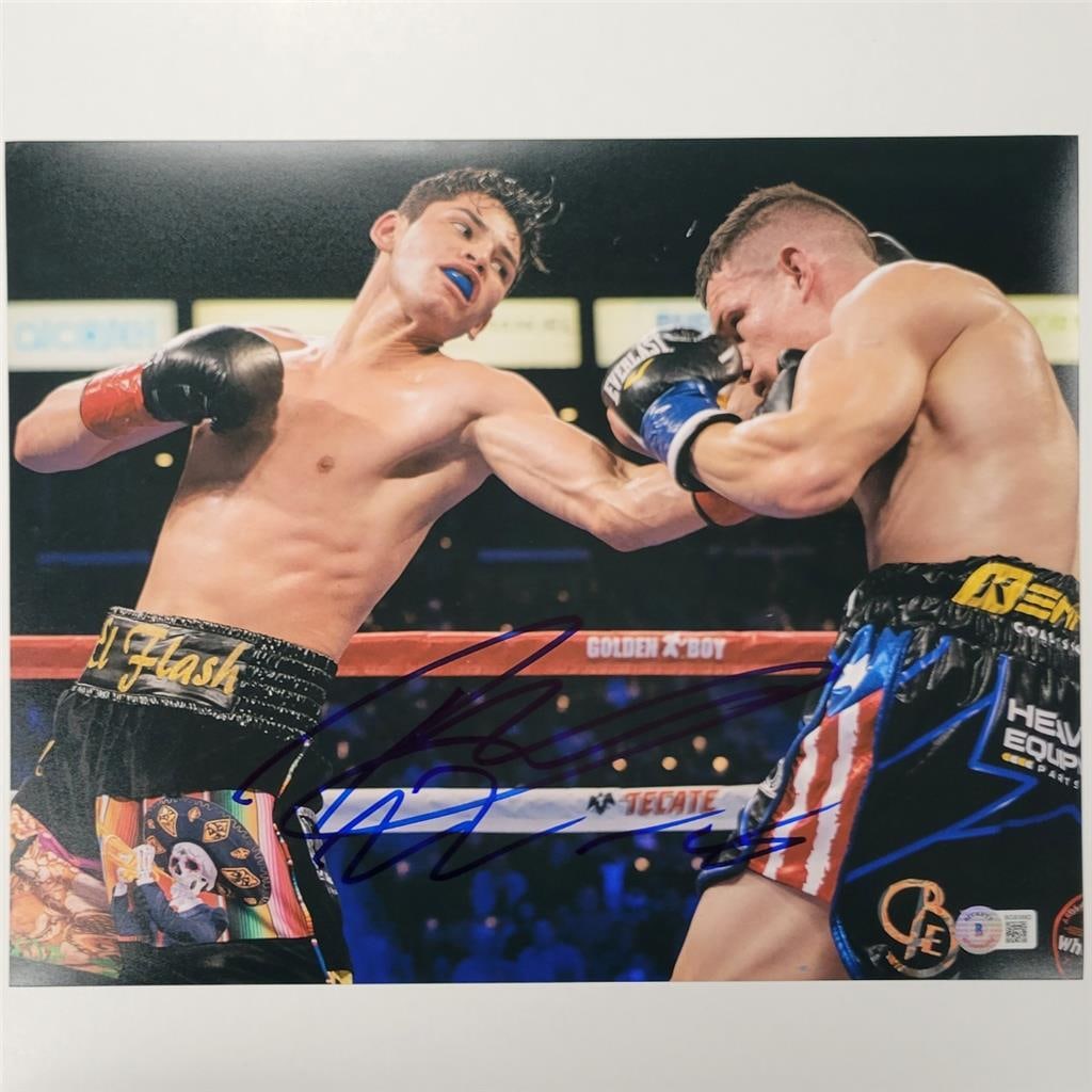 Ryan Garcia Autographed 11x14 Boxing Photo Beckett Authenticated: Ryan Garcia Autographed 11x14 Boxing Photo Beckett Authenticated This 11x14 photograph features boxer Ryan Garcia and is hand-signed, commemorating his 22-0 record. The authenticity of the autograph i