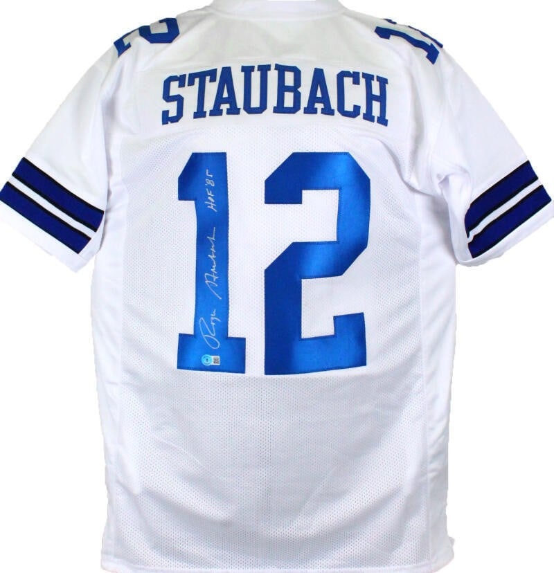 Dallas Cowboys Roger Staubach Signed White Jersey Beckett Hologram: Dallas Cowboys Roger Staubach Signed White Jersey Beckett Hologram Pre-owned white pro style jersey autographed by Roger Staubach. The autograph is authenticated by Beckett Authentication Services and