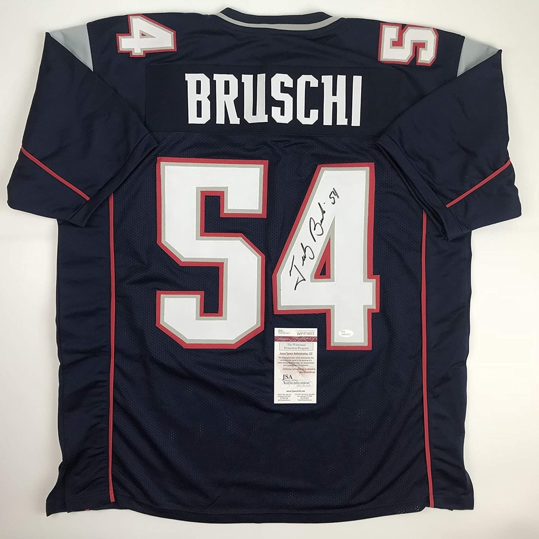 JSA Certified Tedy Bruschi Signed Blue Football Jersey XL: JSA Certified Tedy Bruschi Signed Blue Football Jersey XL Autographed Tedy Bruschi custom football jersey in blue, intended as a collectible display piece. The jersey is signed by Tedy Bruschi and inc
