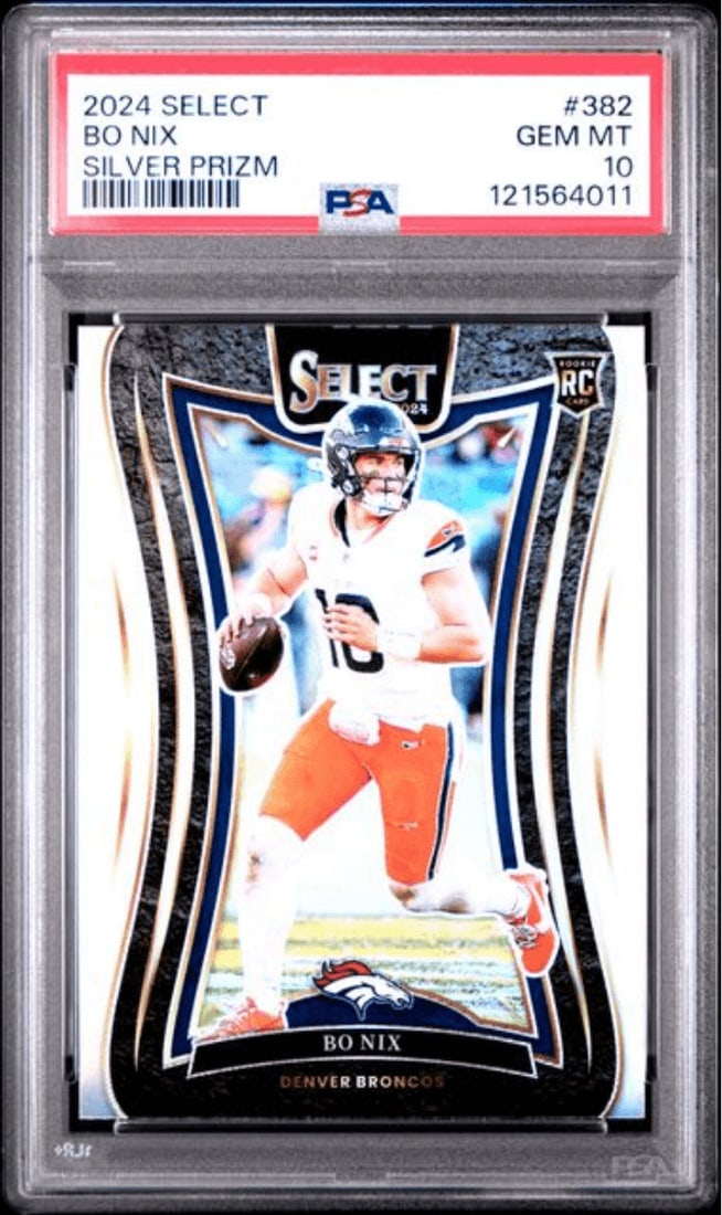 PSA 10 Bo Nix 2024 Panini Select Silver Prizm Rookie #382: PSA 10 Bo Nix 2024 Panini Select Silver Prizm Rookie #382 Graded 2024 Panini Select Bo Nix #382 Silver Prizm rookie sports trading card, encapsulated by PSA with a Gem Mint 10 grade. This football car
