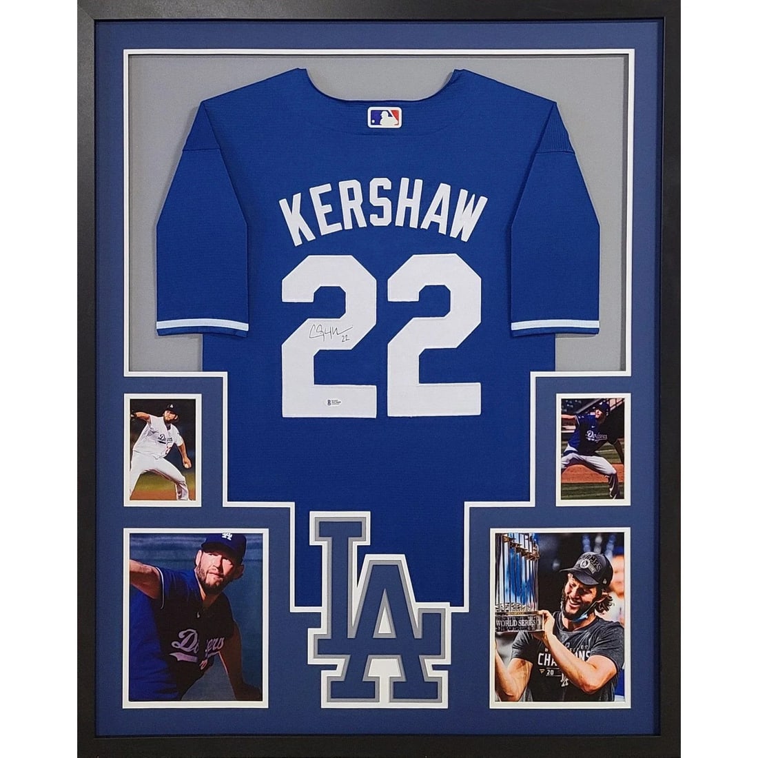 Framed Clayton Kershaw Autographed Dodgers Blue Jersey Beckett Authenticated: Framed Clayton Kershaw Autographed Dodgers Blue Jersey Beckett Authenticated Pre-owned framed blue jersey autographed by Clayton Kershaw. This LA Dodgers display features detailed framing with a logo 