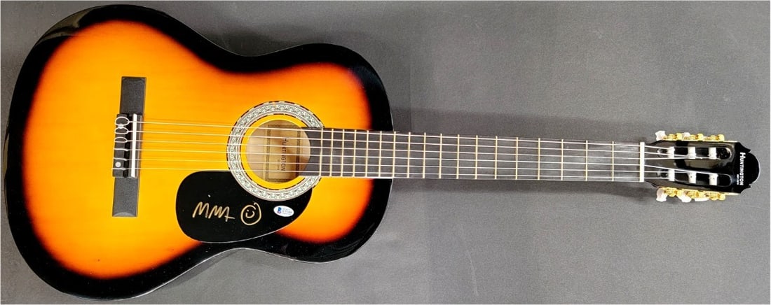 Beckett Authenticated Nina Persson Autograph on Acoustic Guitar: Beckett Authenticated Nina Persson Autograph on Acoustic Guitar Pre-owned original acoustic guitar and guitar pick signed by Nina Persson, singer of The Cardigans. The autograph has been authenticated