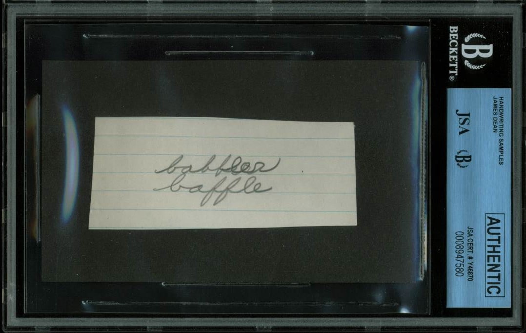 JSA slabbed James Dean handwritten 5th grade notebook sample: JSA slabbed James Dean handwritten 5th grade notebook sample This item is an original handwriting sample from James Dean, taken from his fifth grade notebook. The piece is authenticated and slabbed by
