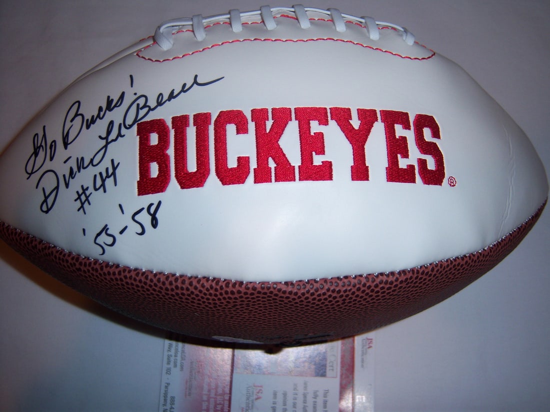 Autographed Football by Dick LeBeau with JSA COA: Autographed Football by Dick LeBeau with JSA COA This is an original football signed by Dick LeBeau, featuring authentication by JSA/COA. The ball represents both the Detroit Lions and Ohio State, mak