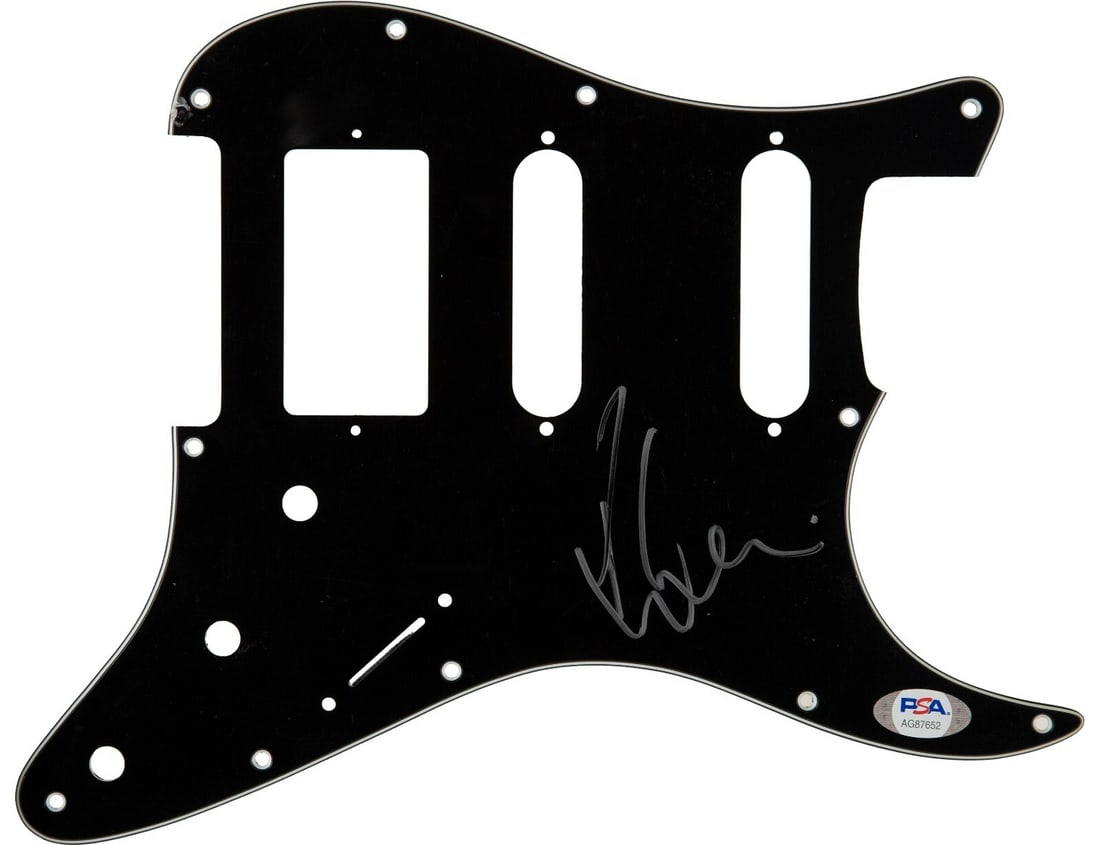Rihanna Autographed Guitar Pickguard PSA DNA COA 2019: Rihanna Autographed Guitar Pickguard PSA DNA COA 2019 This original 2019 guitar pickguard is autographed by the iconic Barbadian singer Rihanna, recognized as the second-best-selling female music arti