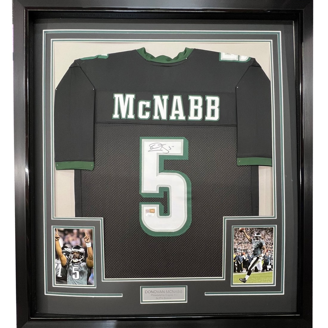 Donovan McNabb autographed framed Philadelphia Eagles black jersey JSA 35x39: Donovan McNabb autographed framed Philadelphia Eagles black jersey JSA 35x39 Professionally framed and matted black Philadelphia Eagles jersey signed by Donovan McNabb. This original autographed footb