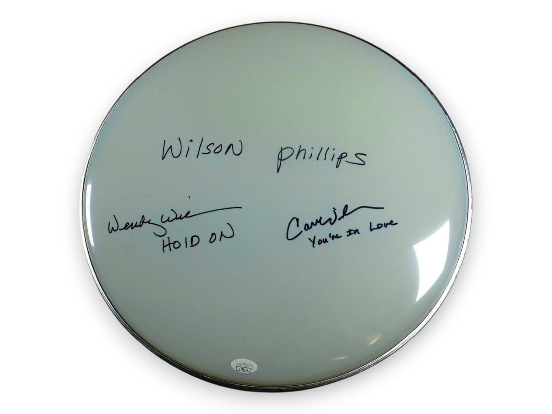 16 Inch Signed Drumhead Carnie and Wendy Wilson JSA Original: 16 Inch Signed Drumhead Carnie and Wendy Wilson JSA Original Original 16-inch drumhead autographed by Carnie Wilson and Wendy Wilson of Wilson Phillips. Each signer added her own song title, and Wendy