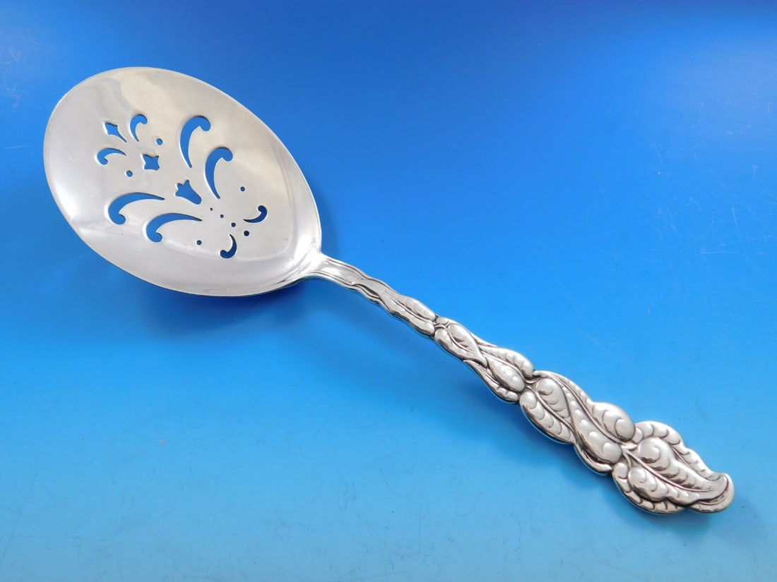 Tiffany Co Ailanthus Sterling Silver Pierced Fried Egg Server 9": Tiffany Co Ailanthus Sterling Silver Pierced Fried Egg Server 9" Pierced fried egg server in the Ailanthus pattern by Tiffany & Co., crafted in sterling silver. This serving piece is not monogrammed a