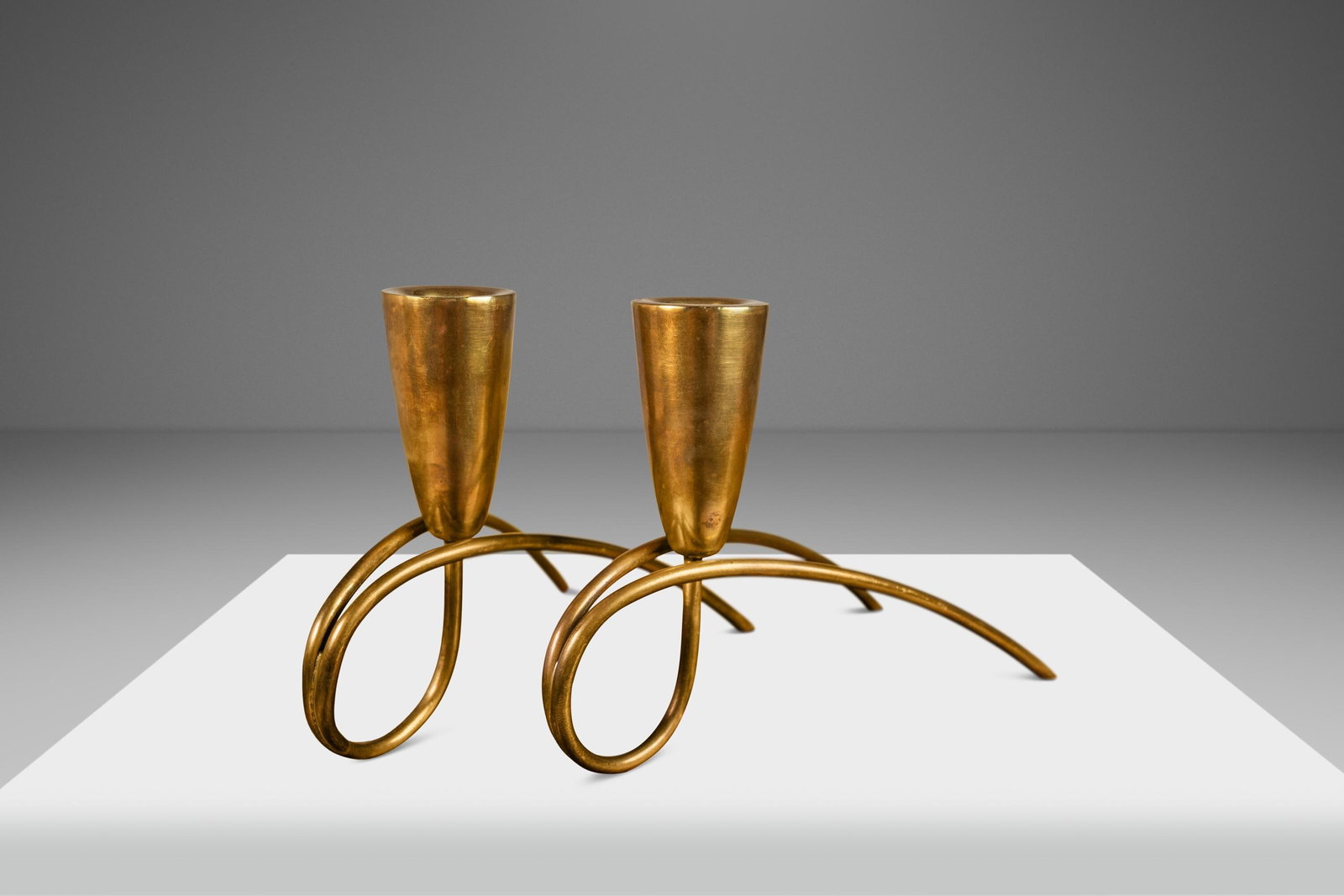 Mid-Century Modern Bauhaus Brass Candlestick Holders by Gunter Kupetz Set of 2: Mid-Century Modern Bauhaus Brass Candlestick Holders by Gunter Kupetz Set of 2 This exquisite set of two Mid-Century Modern Bauhaus candlestick holders, attributed to renowned designer Gunter Kupetz, 