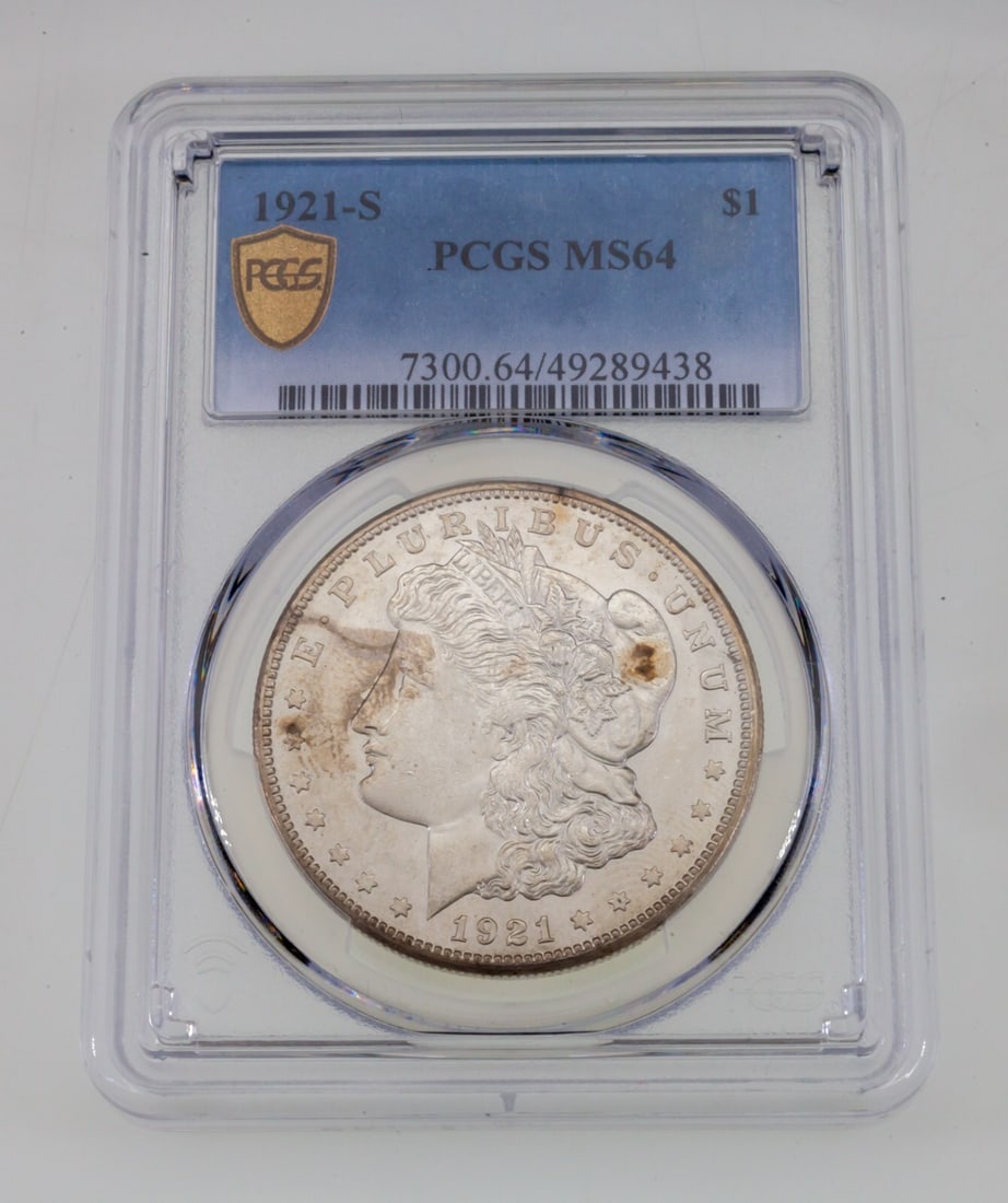 PCGS MS-64 1921-S Morgan Silver Dollar $1: PCGS MS-64 1921-S Morgan Silver Dollar $1 1921-S Morgan Silver Dollar from the United States, struck in silver and graded MS-64 by PCGS. This uncirculated $1 coin is a certified example of the classic