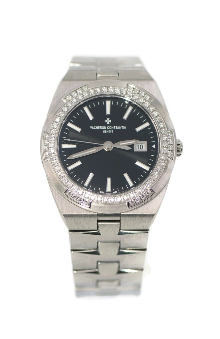 Vacheron Constantin Overseas 1205V 33 mm Diamond Bezel Steel Wristwatch: Vacheron Constantin Overseas 1205V 33 mm Diamond Bezel Steel Wristwatch Pre-owned Vacheron Constantin Overseas women's wristwatch with a quartz movement, stainless steel case and band, black analog di