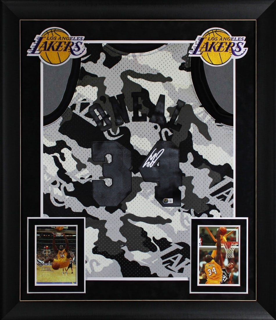 Framed Mitchell and Ness Lakers 96-97 HWC Camo Jersey Signed by Shaquille O'Neal BAS: Framed Mitchell and Ness Lakers 96-97 HWC Camo Jersey Signed by Shaquille O'Neal BAS Professionally framed Mitchell & Ness 1996-97 Hardwood Classics Swingman jersey in black camouflage, personally sig