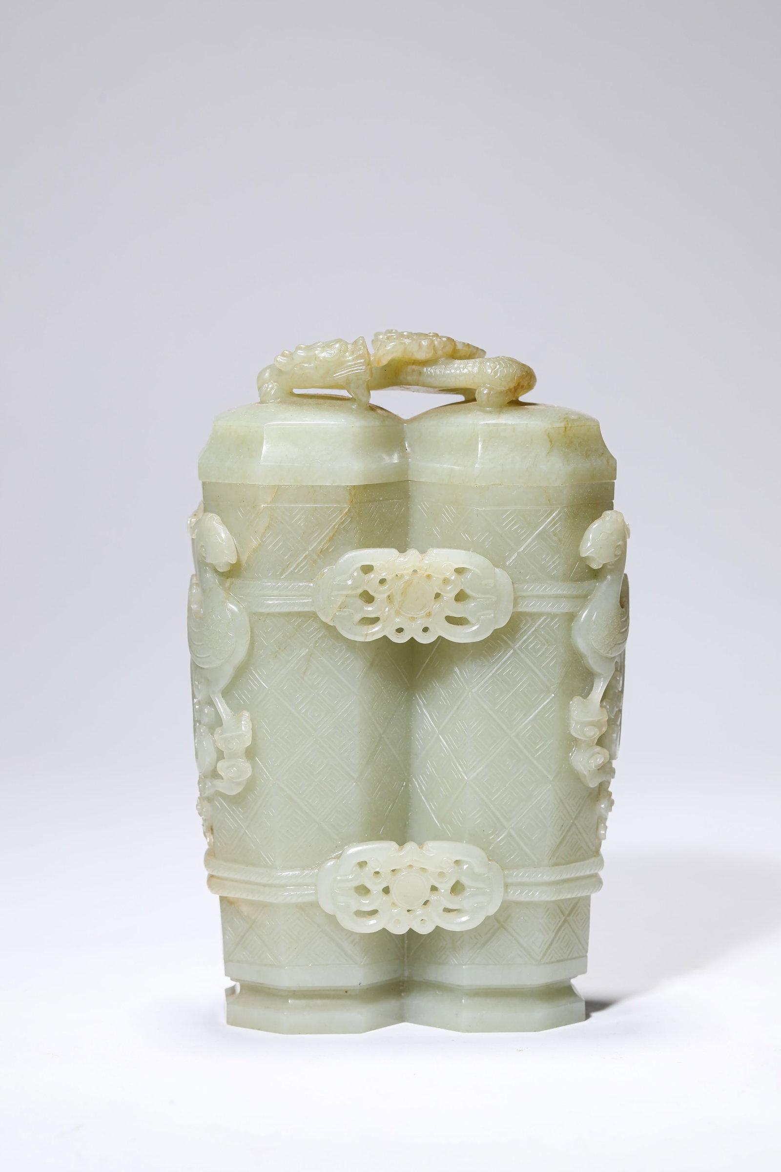 A Jade ‘Dragon and Phoenix’ Twin Vases: A JADE ‘DRAGON AND PHOENIX’ TWIN VASESDescription:Material: Jade Length: 11.2 cm x Width: 6.2 cm x Height: 17.5 cm. All measurements are approximate.