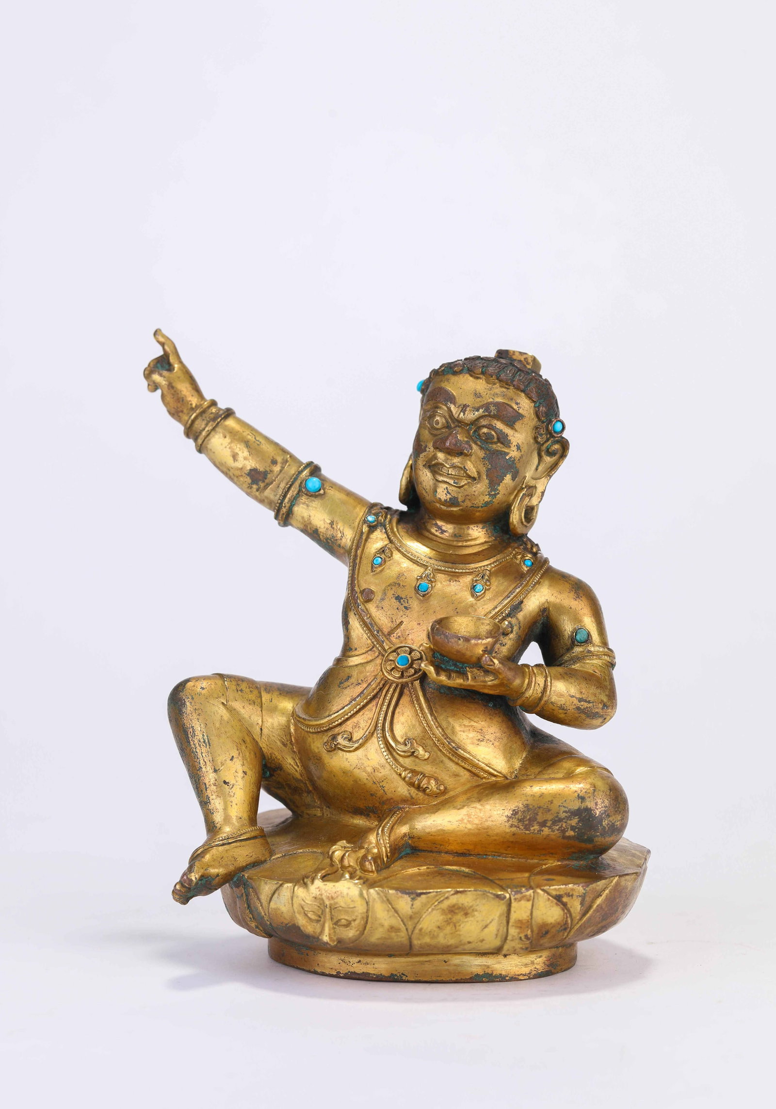 A Figure of a Mahasiddha: A FIGURE OF A MAHASIDDHA Dimensions: Dimensions: Weight: 1304 g. Length: 13 cm x Width: 10 cm x Height: 14.5 cm. All measurements are approximate.