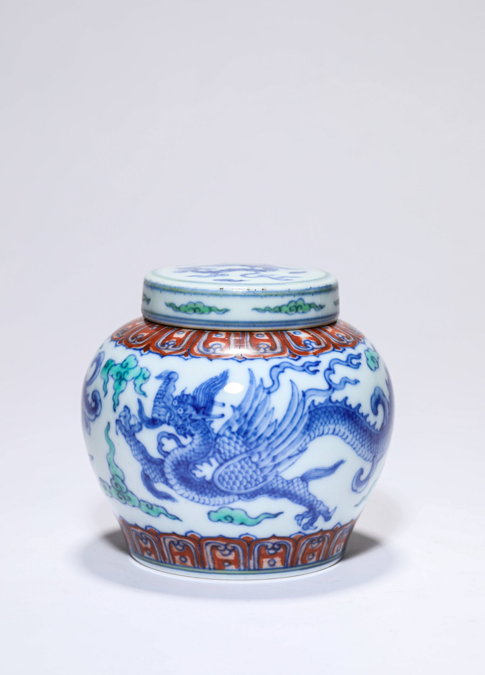 A Doucai 'Dragon and Clouds' 'Tian' Jar: A DOUCAI 'DRAGON AND CLOUDS' 'TIAN' JAR Dimensions: Dimensions: Width: 11 cm x Height: 10 cm. All measurements are approximate.