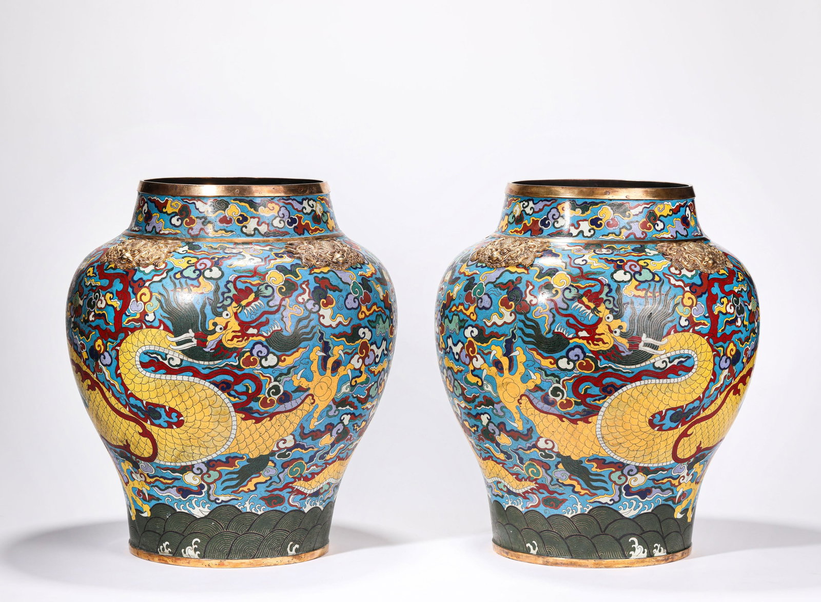 A Pair of Cloisonné Enamel 'Dragon and Clouds' Jars: A PAIR OF CLOISONNÉ ENAMEL 'DRAGON AND CLOUDS' JARS Dimensions: Dimensions: Weight: 12200 g. Width: 34.5 cm x Height: 39.3 cm. All measurements are approximate.