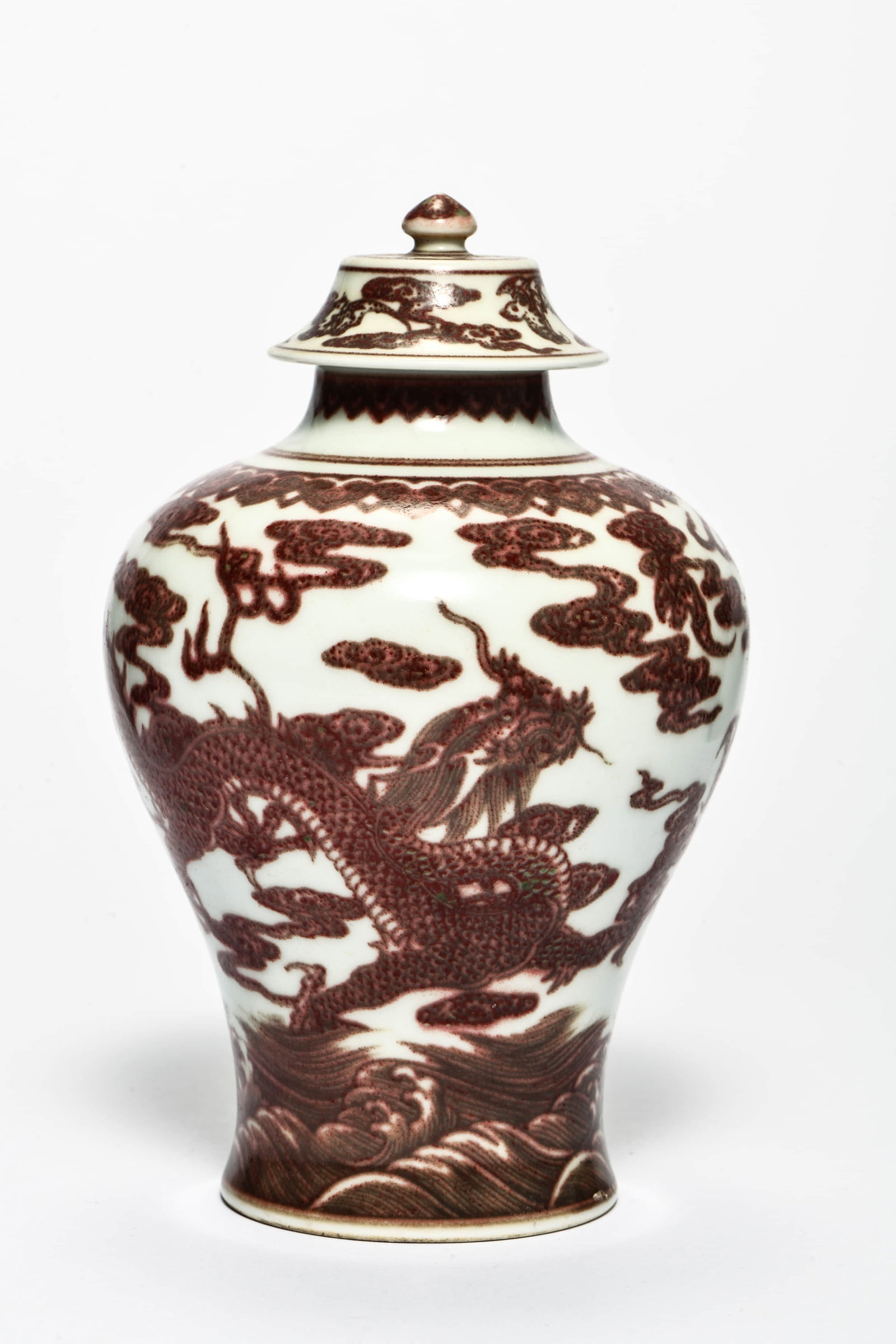 An iron-red 'Pine tree' covered jar: AN IRON-RED 'PINE TREE' COVERED JAR Description: Length: 12cm Width: 12cm Height: 18cm