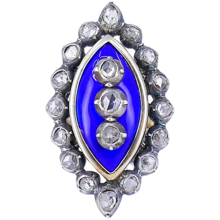 Vintage Blue Enamel and Colorless Stone Navette Ring: VINTAGE BLUE ENAMEL AND COLORLESS STONE NAVETTE RING Provenance and Authenticity: This object is presented as a vintage navette-form ring featuring a vivid cobalt-blue enamel panel surrounded by an