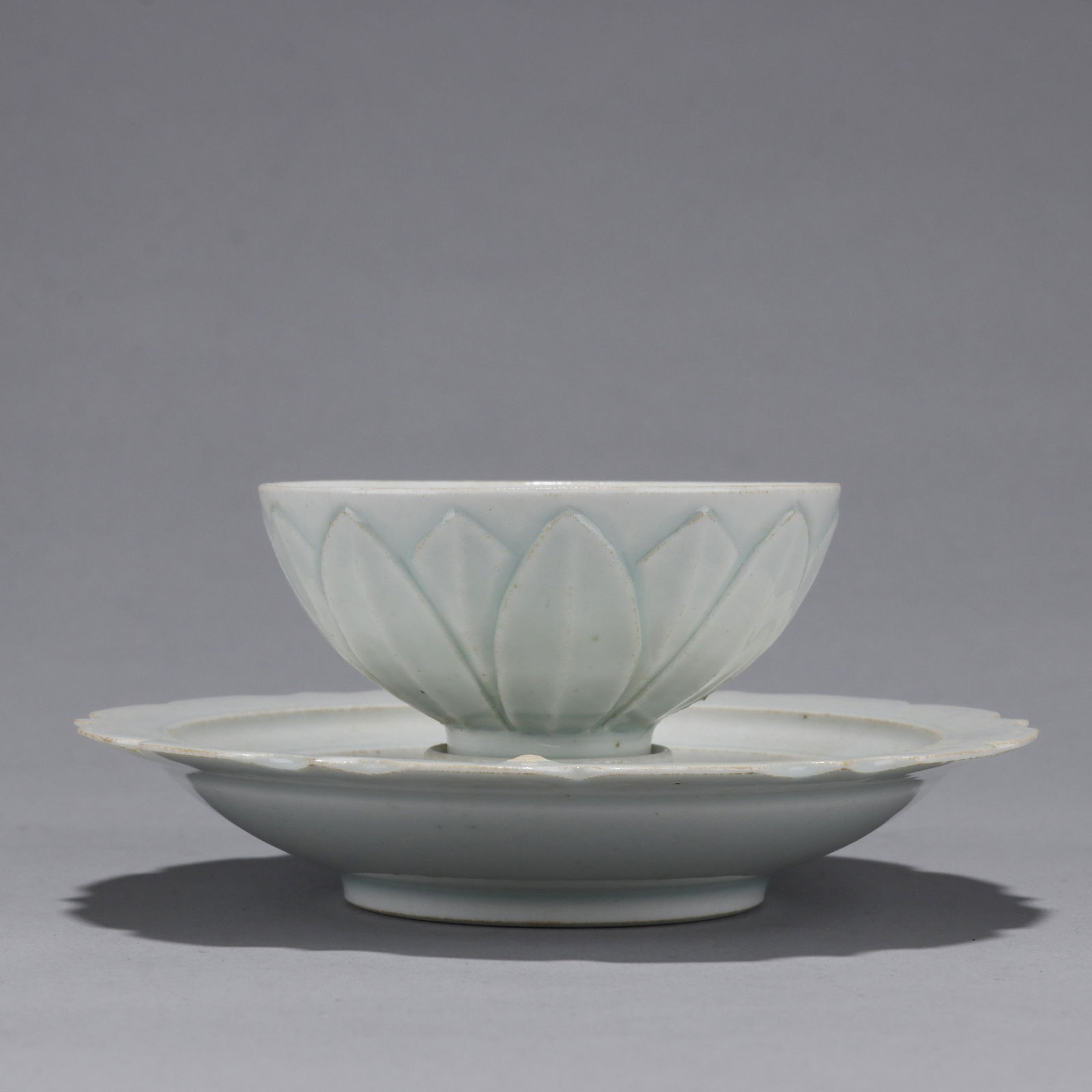 A 'Hutian Yao' Celadon Tea Cup and Holder (1 of 10)