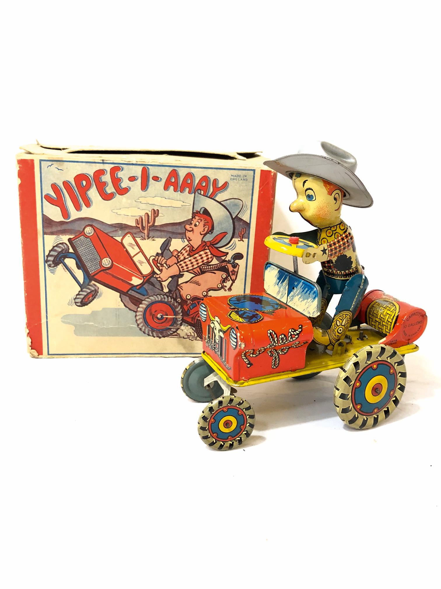 Tin toy Yipee-I-Aaay Made in England: Tin toy Yipee-I-Aaay Made in England. Good condition with original box once glued and a few flaps are loose. Size: 22 x 9 x 19 cm. Condition: Good.