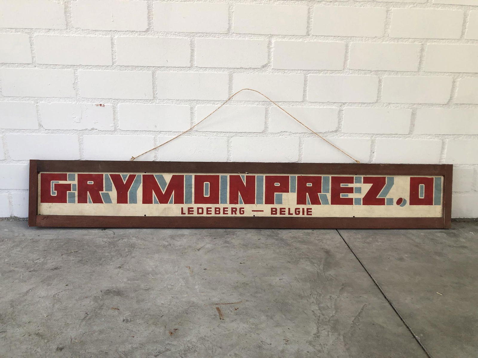 Advertising Sign Grymonprez O., Ledeberg, Belgium: Oscar Grymonprez (1904 â€” 2008) in the 1950s and 1960s, bought up, together with his son, Leonard, many old dance organs and orchestrions, which they repaired, rebuilt and then traded to the Net