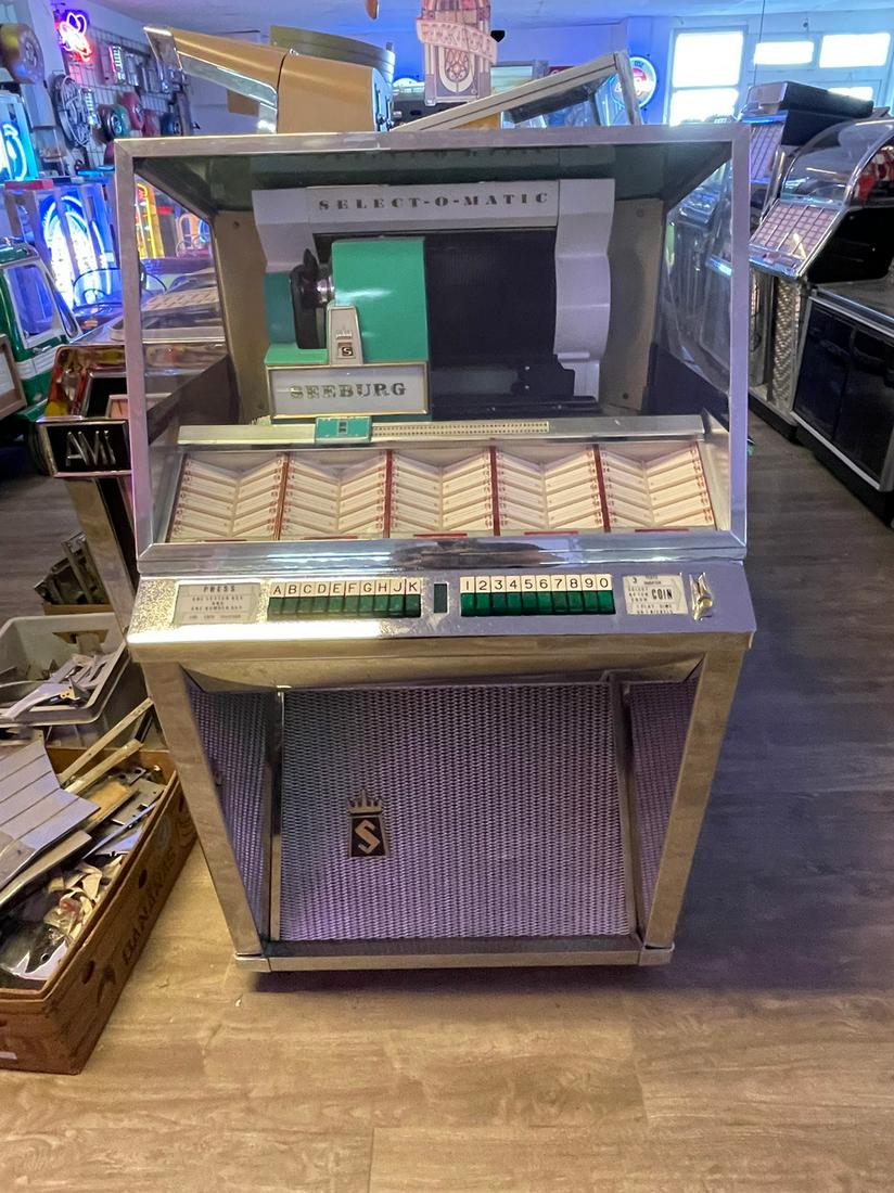 Restored 1957 Seeburg Model L100 Jukebox: Restored 1957 Seeburg Model L100 jukebox in working condition. Plays 100 selctions of 45 rpm records. Height: 137 cm. Width: 77 cm. Depth: 67 cm. Condition: Very Good. Location: The Netherlands.