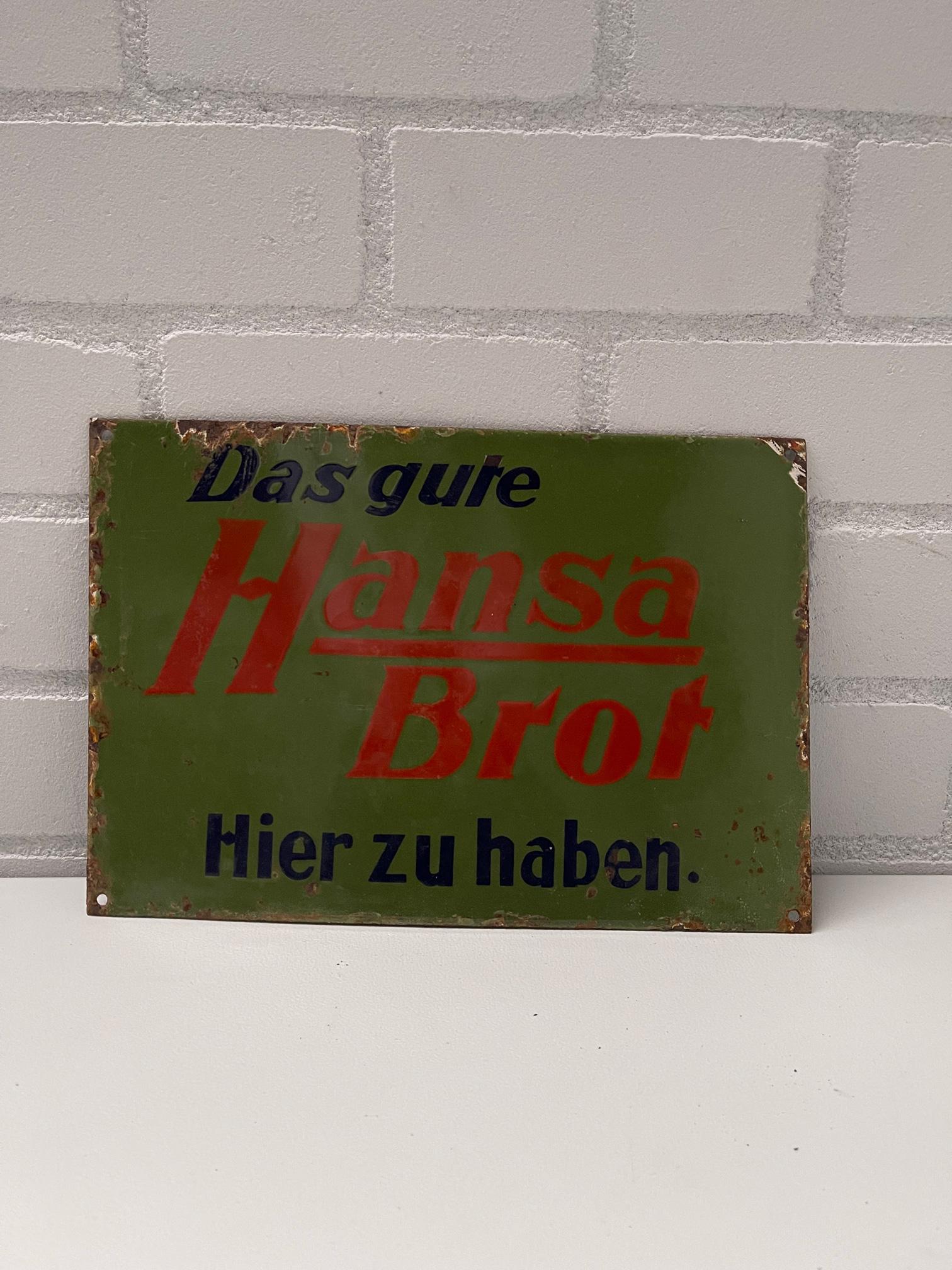 German Hansa Brot Enamel Sign: German Hansa Brot Enamel Sign Height: 37 cm. Width: 26 cm. Depth: 1 cm. Condition: Fair. Location: The Netherlands, Tilburg.