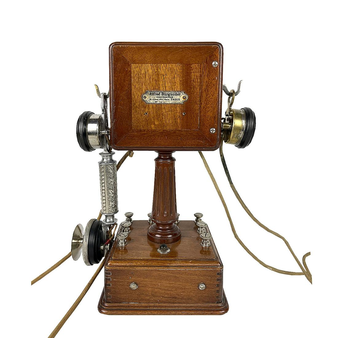 Early Alfred Burgunder Mobile Telephone, ca. 1910, France: Early mobile telephone made by Alfred Burgunder, France, Paris, ca. 1910. The telephone features a mahogany case with square base and a square head conected by a fluted column. A hook one side holds t