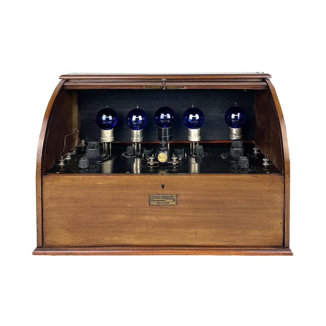 Radio-Alterna 5 Tube Radio, ca. 1923, France: 5 tube radio made by Radio-Alterna - François Gautier, France, Paris ca. 1923. This particular model comes in a wooden case with a tambour cover and 5 blue radio tubes. Working condition untested, bu