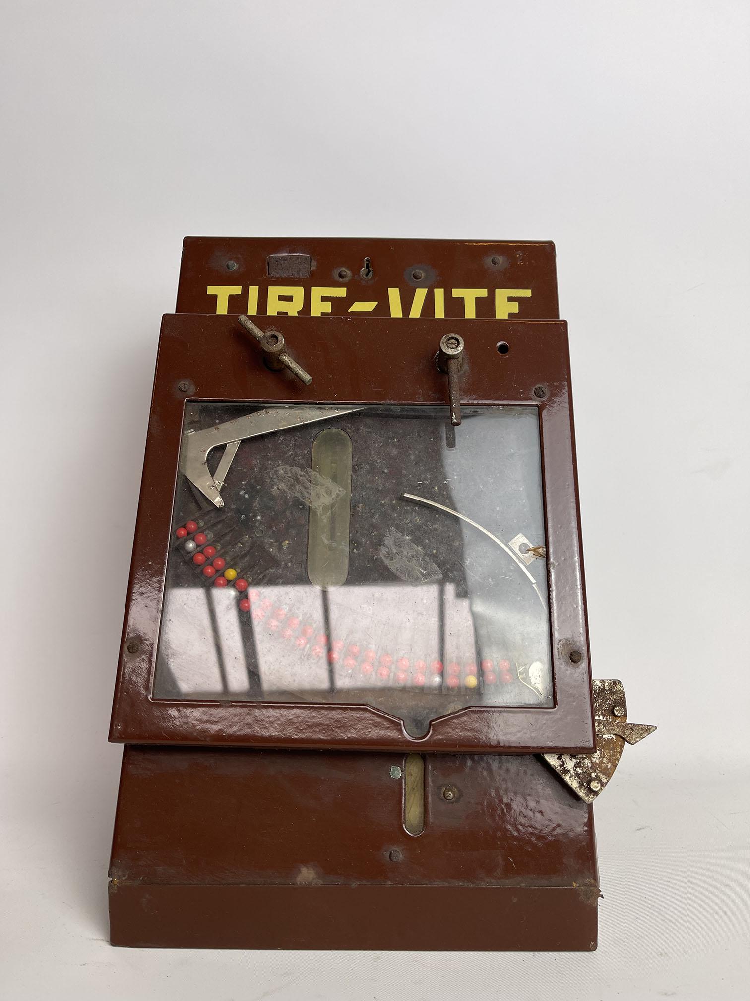 Tire-Vite French Coin-Op Arcade Game ca. 1935: Tire-Vite French wall-mounted coin-operated arcade game in a tin case ca. 1935. Moving arm sweeps small balls into the chute to award prize. Working condition not tested, but appears to be complete. H