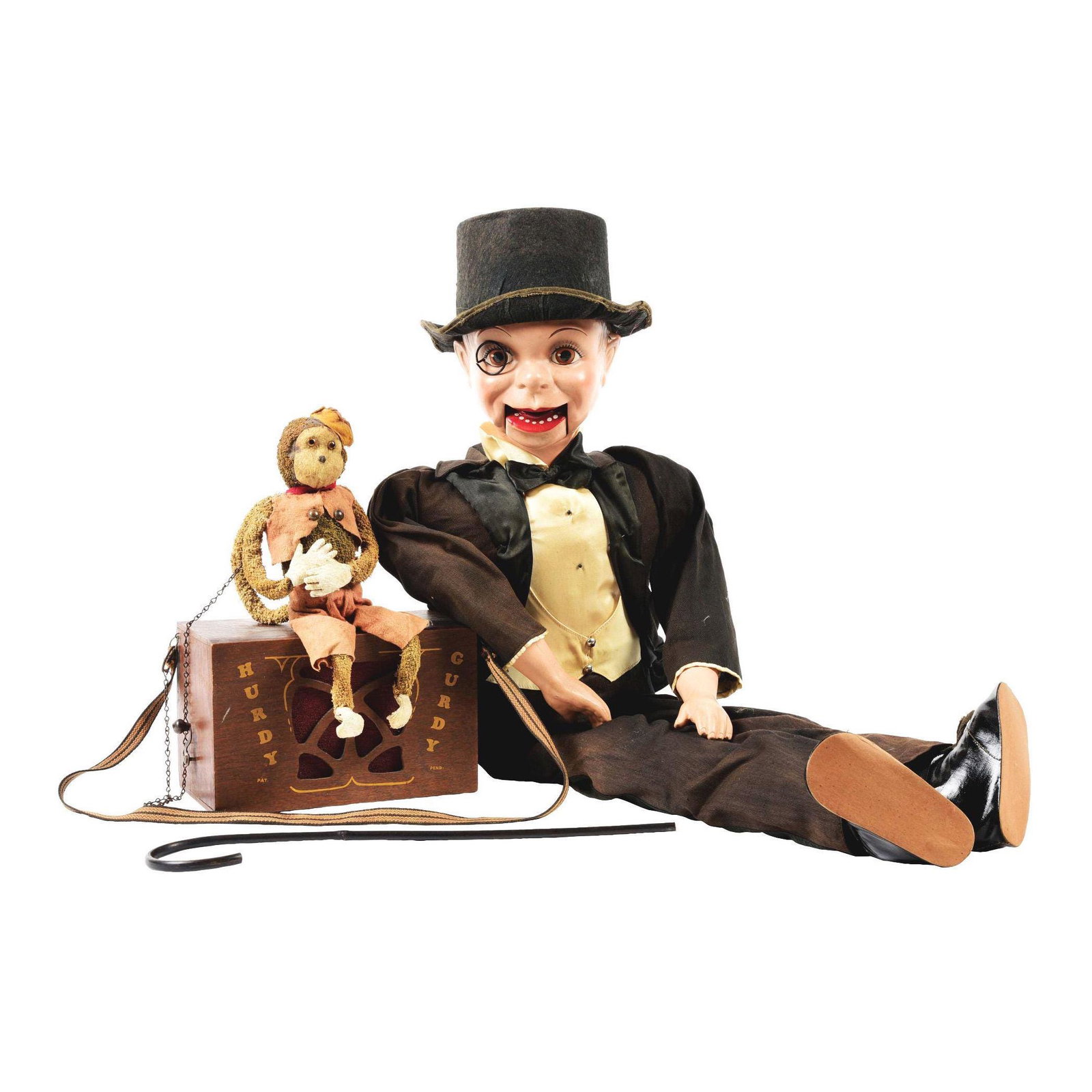 lot of 2: Ventriloquist Dummy & Hurdy Gurdy with Monkey: This is a lot of two items. First is a Charlie McCarthy ventriloquist doll in original working condition, original clothes showing wear. The second is a Miniature Hurdy Gurdy music box with monkey. Gr
