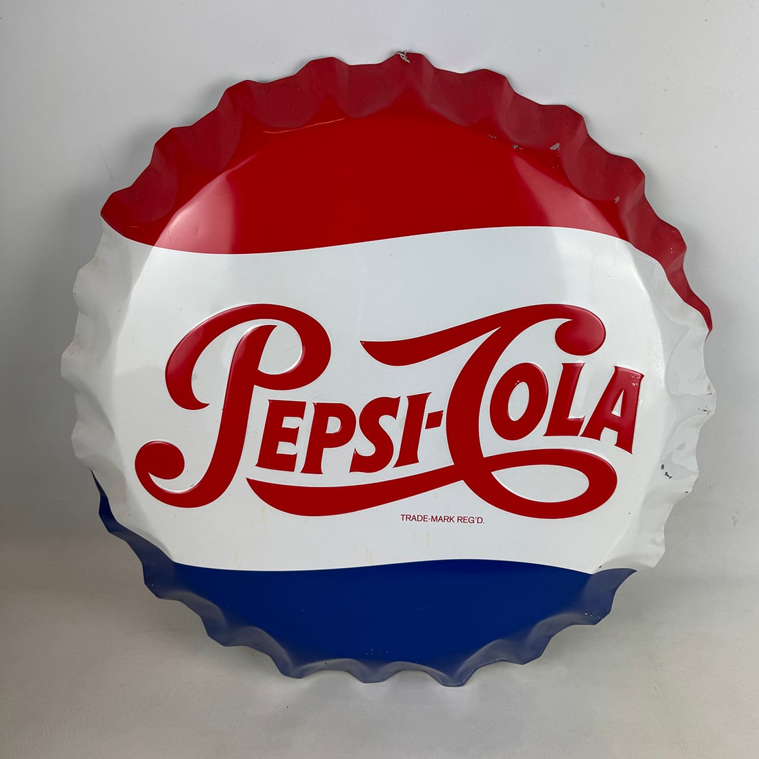 Metal Pepsi-Cola Advertising Sign: Pepsi Cola 60-70's small tin button. Dimensions (H x W x D): 67 x 68 x 8 cm. Condition: Very Good. Location: The Netherlands.