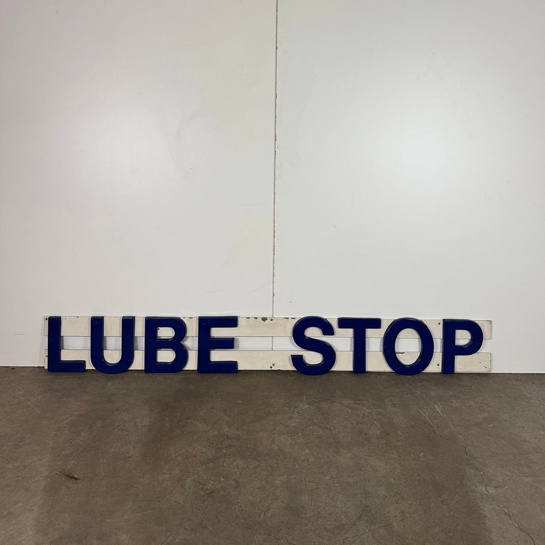 Service Centre Advertising Sign Lube Stop: Service Centre Advertising Sign Lube Stop. Dimensions (H x W x D): 33 x 245 x 4 cm. Location: The Netherlands.